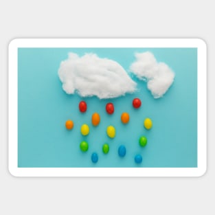 Photo illustration depicting clouds and rainbow-colored raindrops Sticker